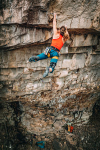 Laurel Graefe sticking the big move on Rockstar at Shaman Cave (Denny Cove) in Tennessee.