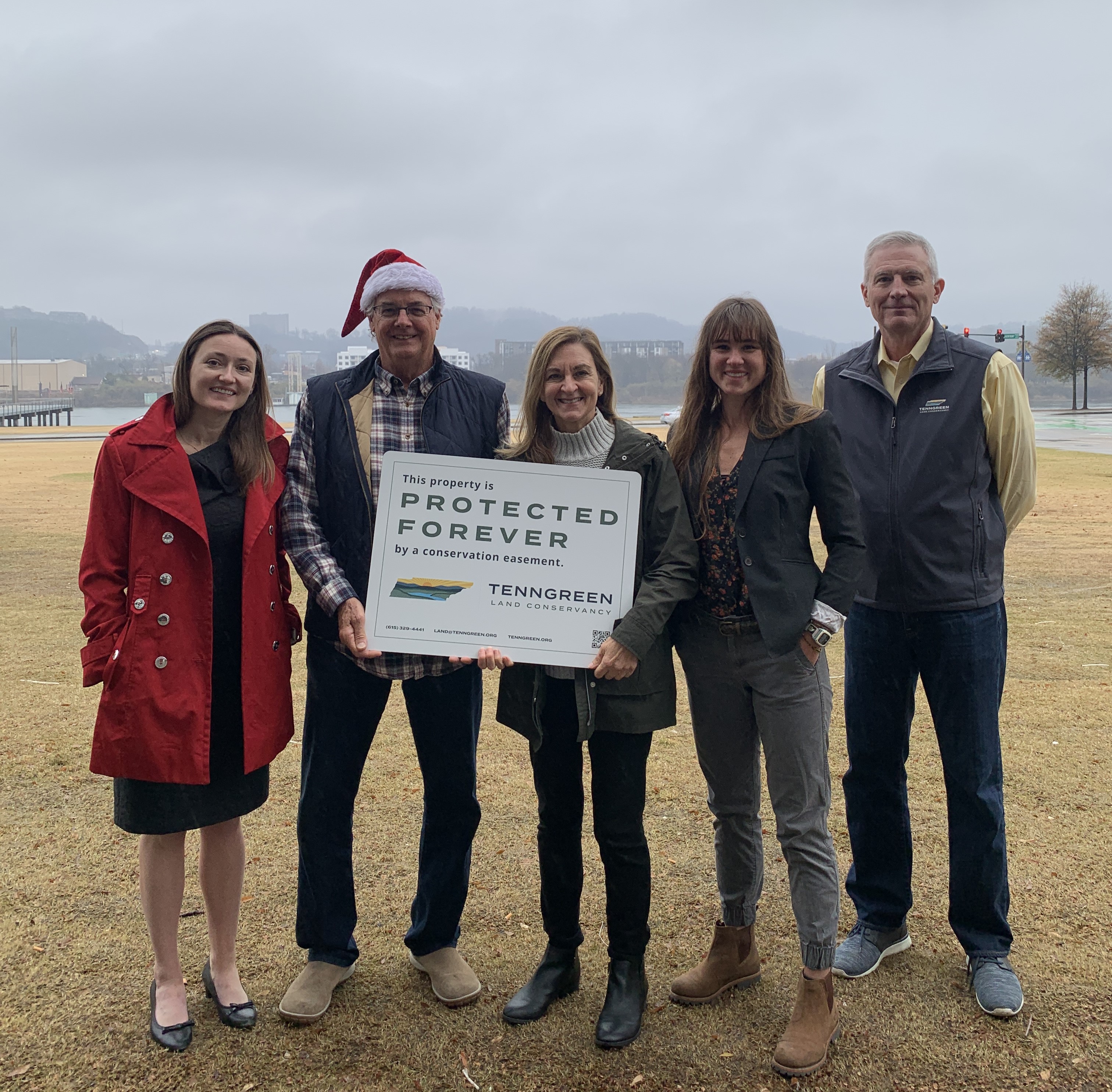 From Left: Executive Director Alice Hudson Pell, Landowners Van & Corinne Bunch, Conservation Project Manager Kristen Hanratty, and Board President Mark Peacock at signing of Laurel Trace